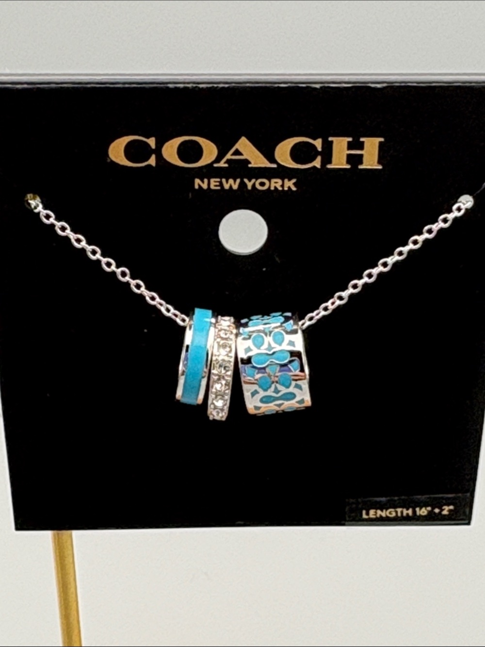 COACH Silver Necklace with Turquoise and Crystal Accent Rings